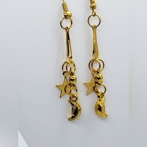 Gold colored moon and star dangling earrings